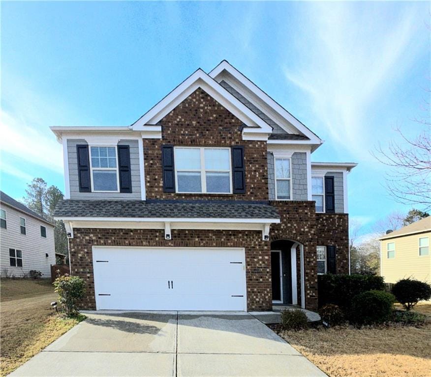 view of front of property featuring a garage