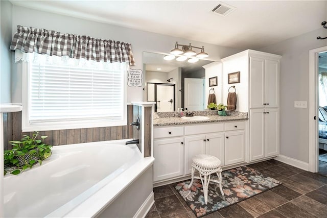full bath with a bath, vanity, visible vents, and a stall shower