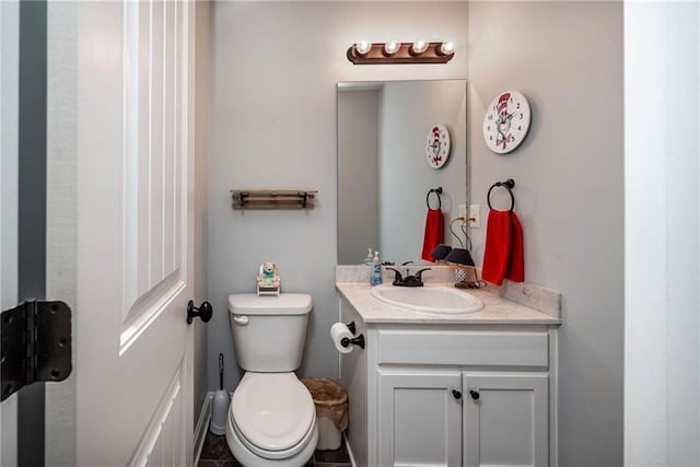 bathroom with toilet and vanity