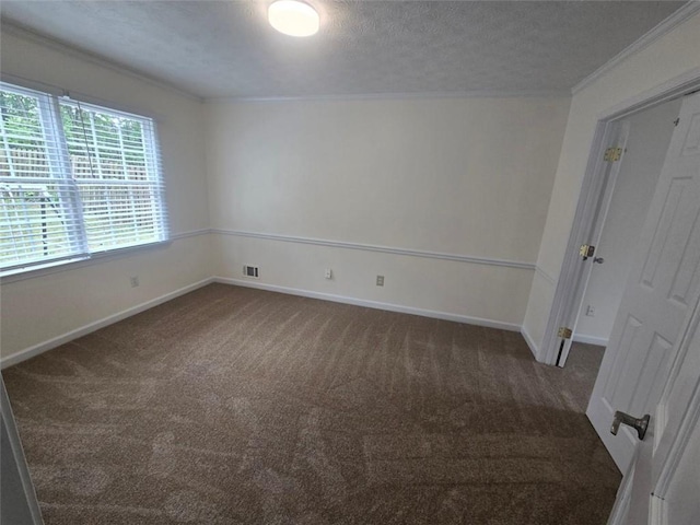 639 Royal Abbey Dr, Stone Mountain, GA 30088 - carpeted empty room with ornamental molding, a textured ceiling, and baseboards
