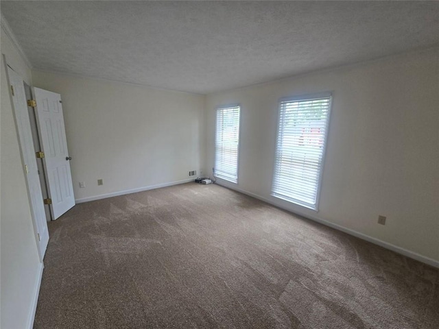 639 Royal Abbey Dr, Stone Mountain, GA 30088 - carpeted empty room featuring a textured ceiling and baseboards