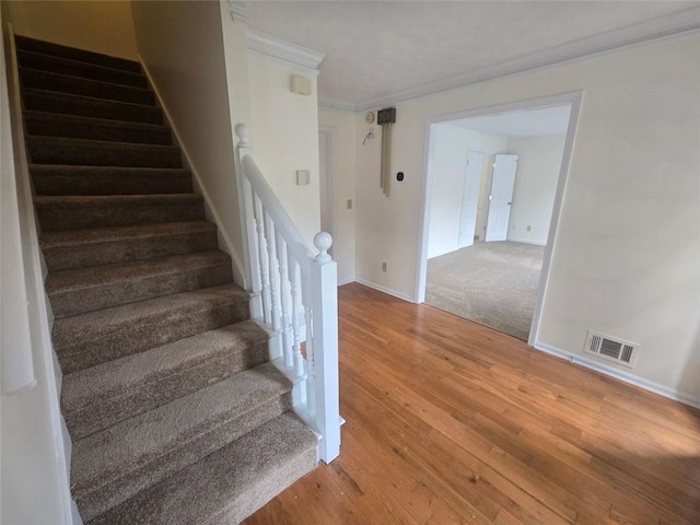 639 Royal Abbey Dr, Stone Mountain, GA 30088 - stairs with ornamental molding, wood finished floors, and baseboards