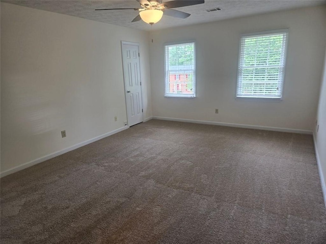 639 Royal Abbey Dr, Stone Mountain, GA 30088 - spare room featuring a ceiling fan, carpet, and baseboards