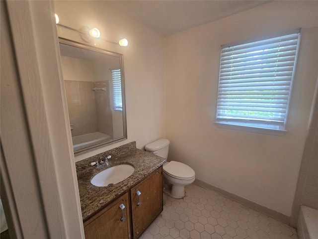 639 Royal Abbey Dr, Stone Mountain, GA 30088 - bathroom with vanity, bathing tub / shower combination, toilet, and baseboards