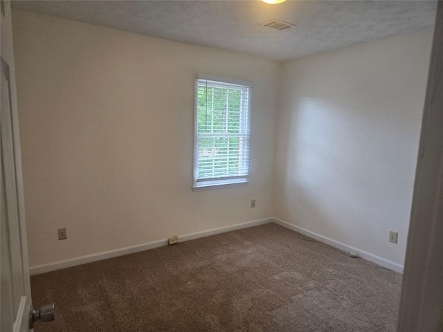 639 Royal Abbey Dr, Stone Mountain, GA 30088 - carpeted empty room featuring baseboards and a textured ceiling