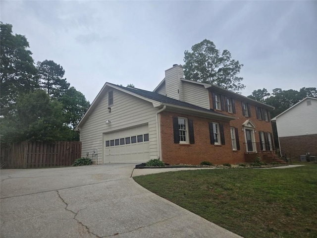 639 Royal Abbey Dr, Stone Mountain, GA 30088 - view of home's exterior with concrete driveway, brick siding, a garage, a chimney, and cooling unit