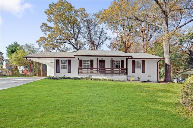 ranch-style house with a carport, covered porch, and a front lawn