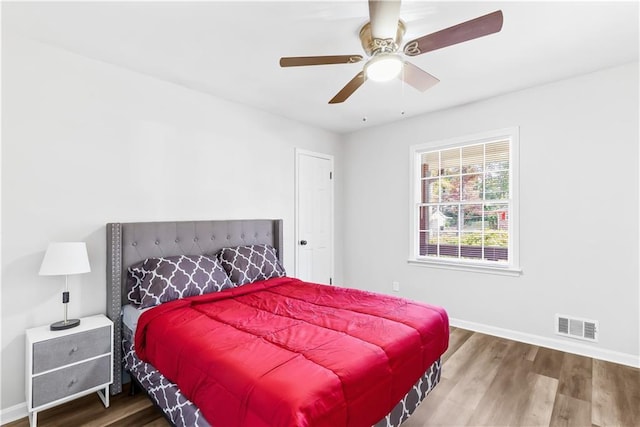 bedroom featuring hardwood / wood-style floors and ceiling fan