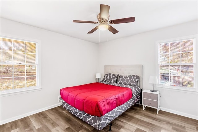 bedroom with ceiling fan and hardwood / wood-style floors