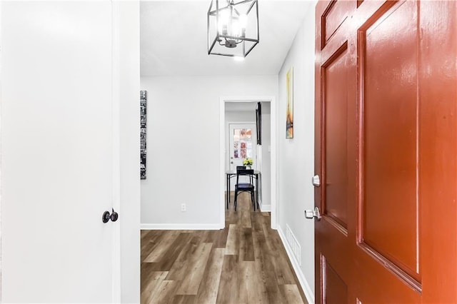 hallway with wood-type flooring