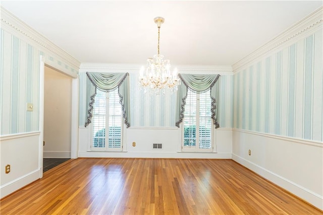 5287 Vernon Lake Dr, Atlanta, GA 30338 - unfurnished dining area with a chandelier, wood finished floors, baseboards, crown molding, and wallpapered walls
