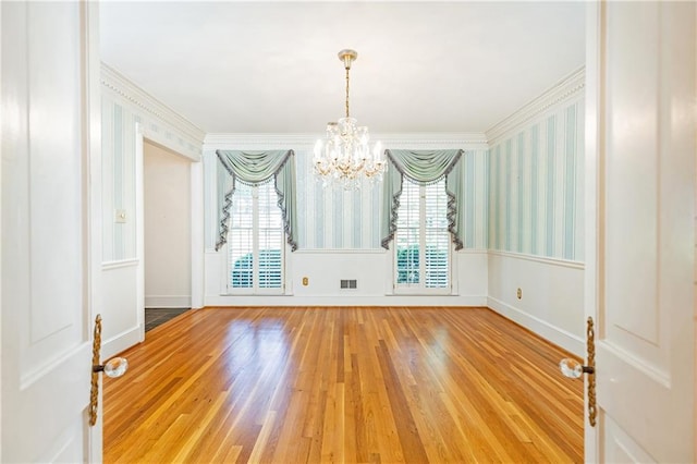 5287 Vernon Lake Dr, Atlanta, GA 30338 - unfurnished room with a chandelier, wood finished floors, ornamental molding, and baseboards