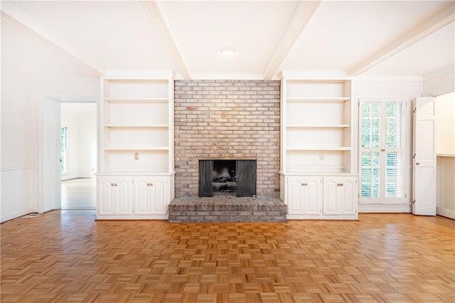 5287 Vernon Lake Dr, Atlanta, GA 30338 - unfurnished living room featuring plenty of natural light, beamed ceiling, built in features, and a brick fireplace