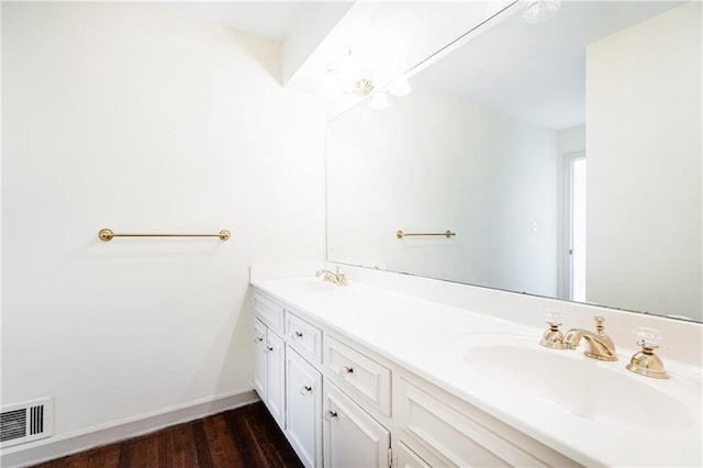 5287 Vernon Lake Dr, Atlanta, GA 30338 - bathroom featuring double vanity, wood finished floors, and baseboards