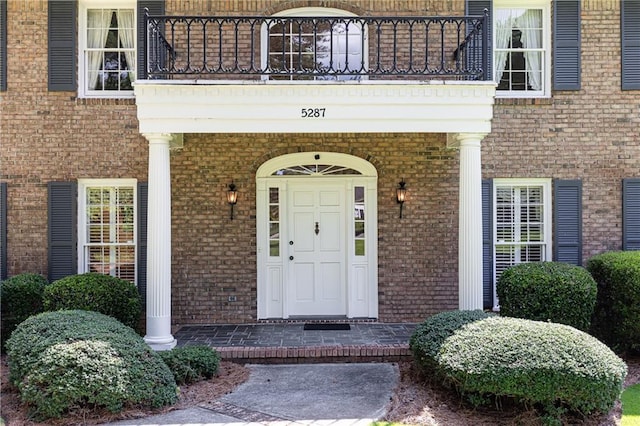 5287 Vernon Lake Dr, Atlanta, GA 30338 - doorway to property with a balcony and brick siding