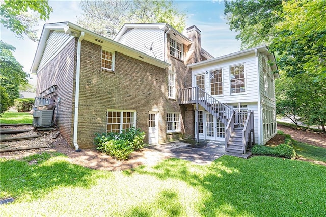 5287 Vernon Lake Dr, Atlanta, GA 30338 - rear view of house with stairway, a yard, brick siding, and a patio area