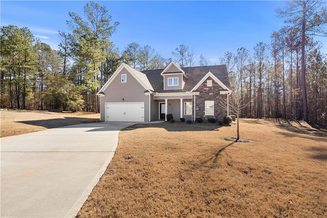 view of front of house featuring a front yard and a garage