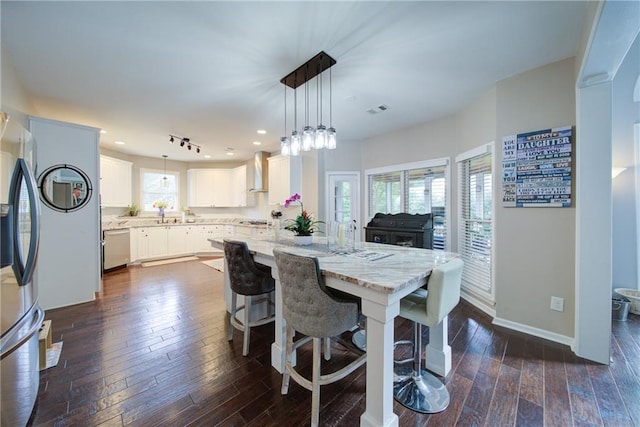 4645 Waterford Dr, Suwanee, GA 30024 - dining room with dark wood-type flooring, baseboards, and recessed lighting