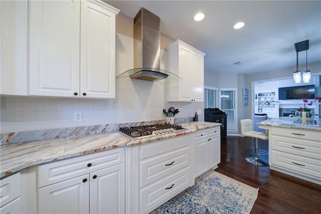 4645 Waterford Dr, Suwanee, GA 30024 - kitchen featuring wall chimney exhaust hood, open floor plan, stainless steel gas stovetop, tasteful backsplash, and recessed lighting