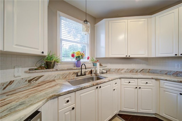 4645 Waterford Dr, Suwanee, GA 30024 - kitchen with a sink, white cabinetry, decorative backsplash, and pendant lighting