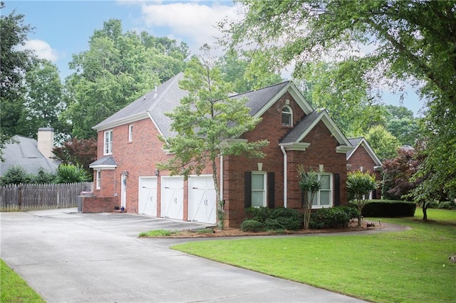 4645 Waterford Dr, Suwanee, GA 30024 - traditional home featuring concrete driveway, a garage, and brick siding