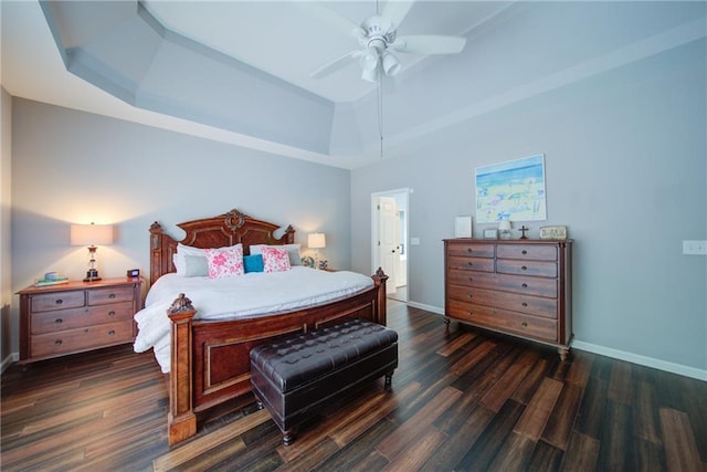 4645 Waterford Dr, Suwanee, GA 30024 - bedroom with a tray ceiling, dark wood finished floors, baseboards, and ceiling fan