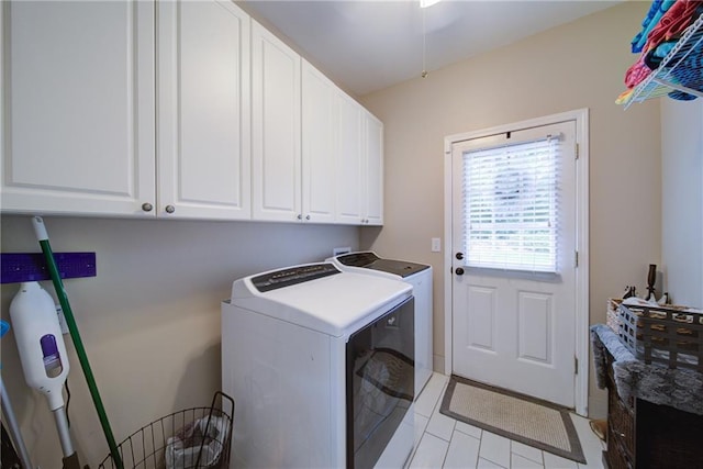4645 Waterford Dr, Suwanee, GA 30024 - laundry area featuring independent washer and dryer, cabinet space, and light tile patterned flooring