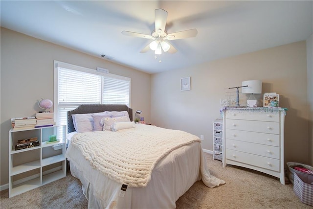 4645 Waterford Dr, Suwanee, GA 30024 - bedroom with light colored carpet, ceiling fan, and baseboards