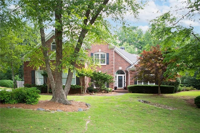 4645 Waterford Dr, Suwanee, GA 30024 - view of front of house with a front yard and brick siding