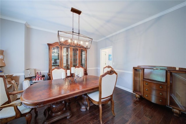 4645 Waterford Dr, Suwanee, GA 30024 - dining room with dark wood finished floors, ornamental molding, a chandelier, and baseboards