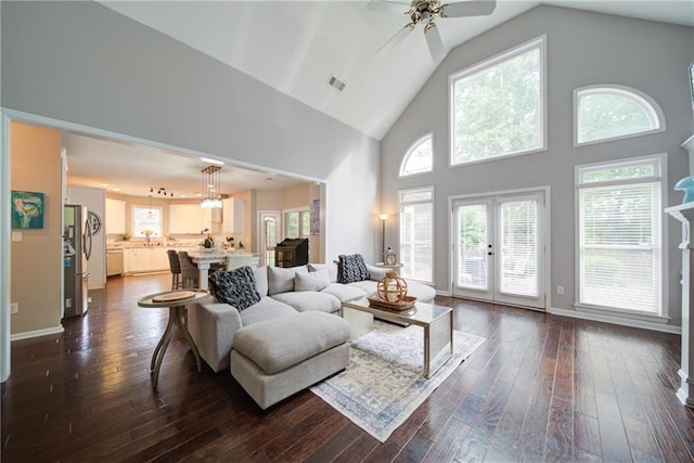4645 Waterford Dr, Suwanee, GA 30024 - living area featuring high vaulted ceiling, dark wood finished floors, ceiling fan, french doors, and baseboards