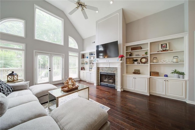 4645 Waterford Dr, Suwanee, GA 30024 - living room with high vaulted ceiling, dark wood-style floors, a ceiling fan, a fireplace, and french doors