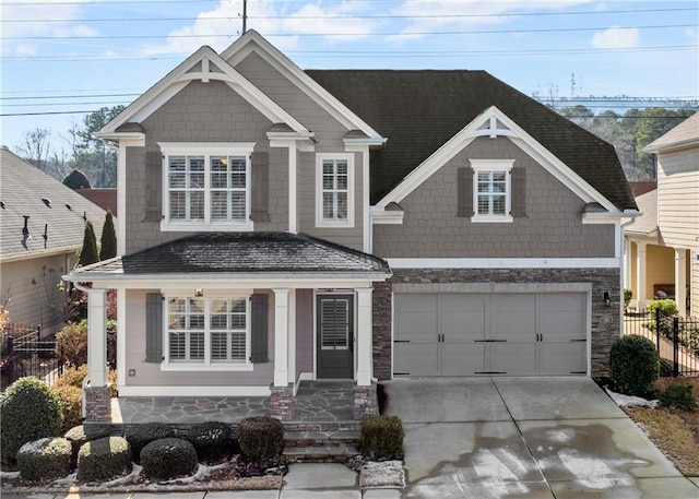 craftsman house featuring a porch and a garage