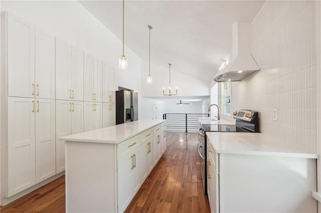 kitchen with premium range hood, white cabinetry, a center island, pendant lighting, and stainless steel appliances