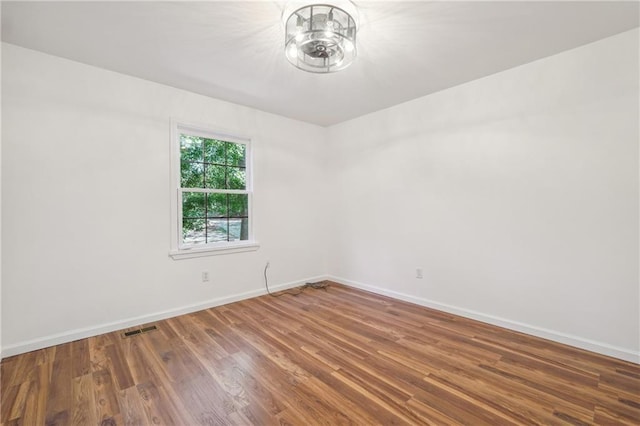 spare room featuring hardwood / wood-style flooring