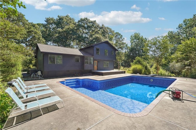 view of swimming pool featuring a patio area