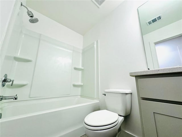bathroom featuring toilet, vanity, and shower / washtub combination