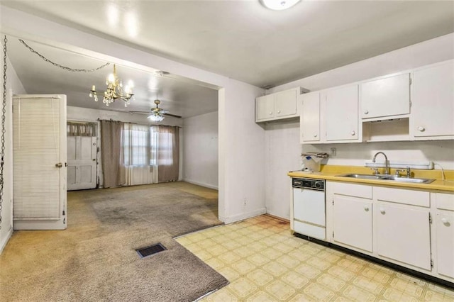 kitchen with visible vents, light floors, dishwasher, white cabinetry, and a sink