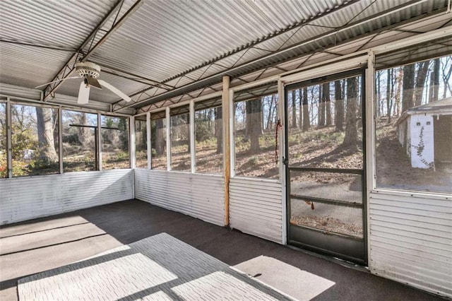 unfurnished sunroom with ceiling fan