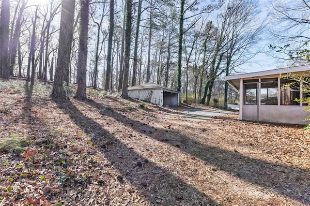 view of yard featuring a sunroom