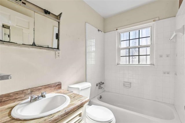 bathroom featuring vanity, toilet, and shower / tub combination