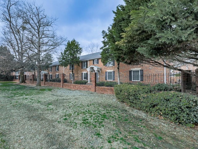 view of front of property featuring brick siding