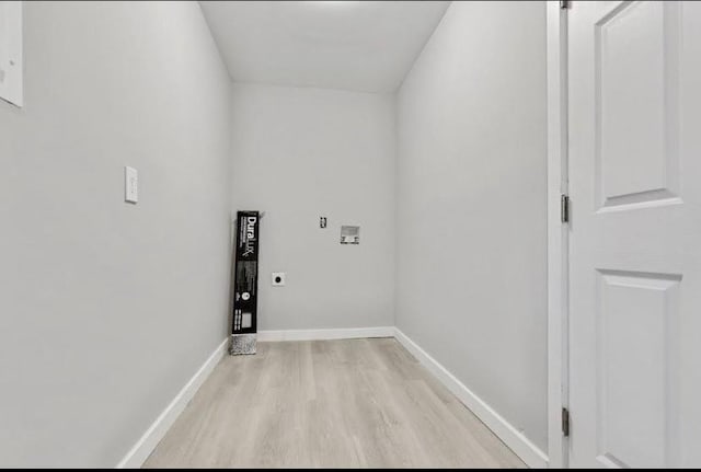 1382 Bennett Rd, Grayson, GA 30017 - laundry room with electric dryer hookup, light wood finished floors, washer hookup, and baseboards