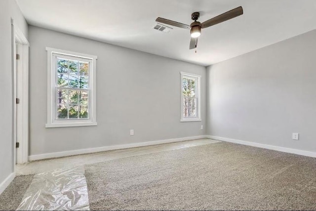 1382 Bennett Rd, Grayson, GA 30017 - empty room featuring a ceiling fan, plenty of natural light, light carpet, and baseboards