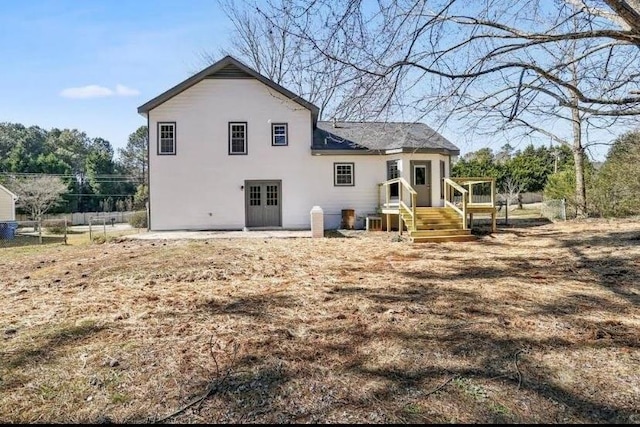 1382 Bennett Rd, Grayson, GA 30017 - rear view of house featuring fence and stucco siding