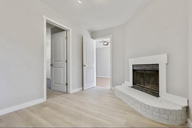1382 Bennett Rd, Grayson, GA 30017 - unfurnished living room with wood finished floors, a fireplace, and baseboards