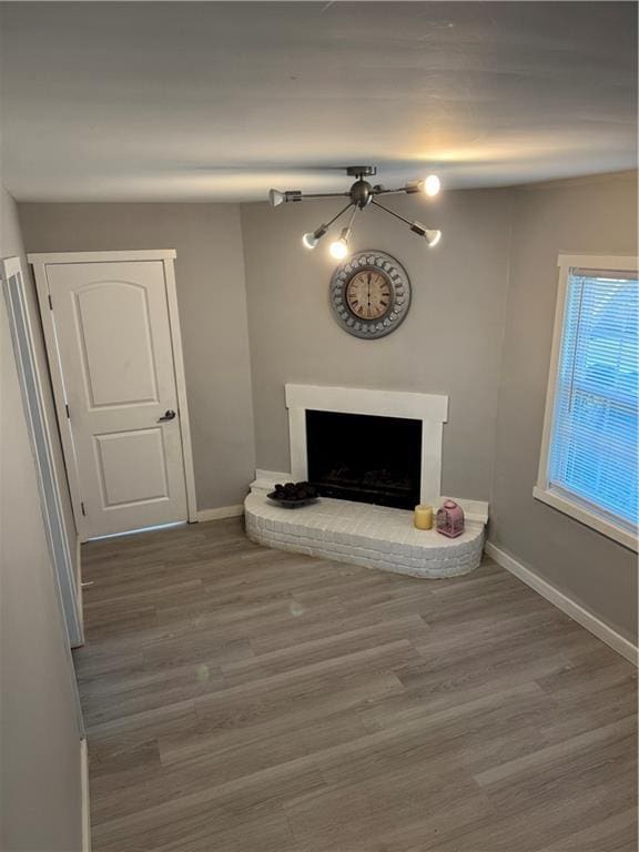 1382 Bennett Rd, Grayson, GA 30017 - living area featuring a fireplace, baseboards, and wood finished floors