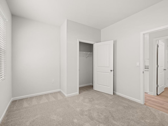 885 Lost Creek Blvd, Dallas, GA 30132 - unfurnished bedroom featuring light carpet and a closet
