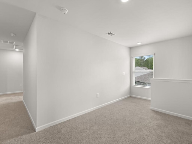 885 Lost Creek Blvd, Dallas, GA 30132 - empty room featuring light colored carpet and a smoke detector
