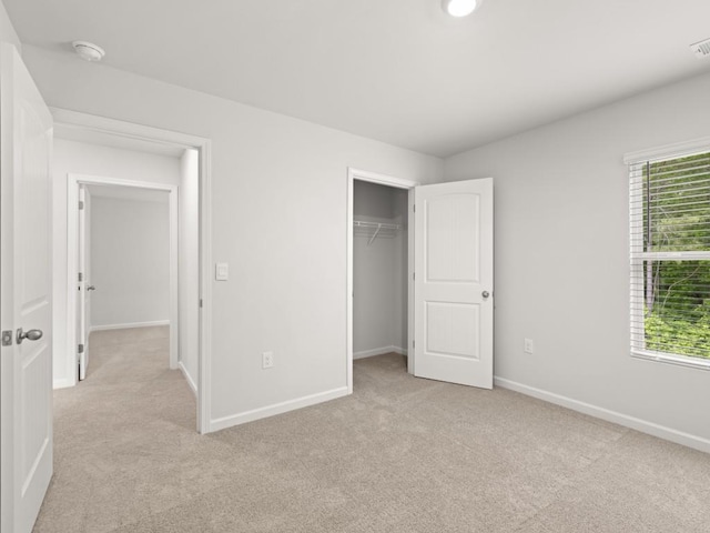 885 Lost Creek Blvd, Dallas, GA 30132 - unfurnished bedroom with light carpet, multiple windows, and a closet